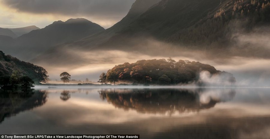 Top prize: This beautiful image, called 'Mist and Reflections' taken on Crummock Water, Cumbria, by Tony Bennett, was the overall winner of the competition